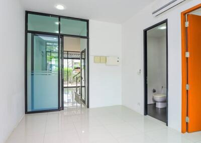 View of a room with access to a bathroom and an outdoor area