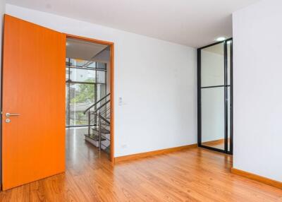 bedroom with open door to staircase