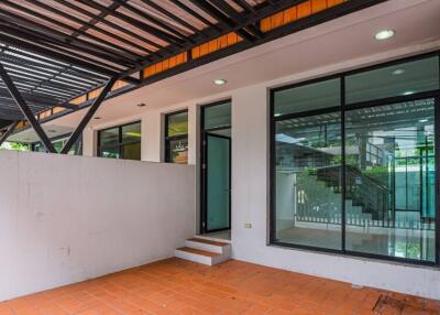 Covered patio with glass doors and stairs