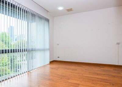 Living room with large windows and wooden floors