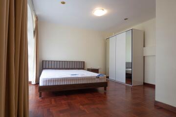 Bright and spacious bedroom with large windows