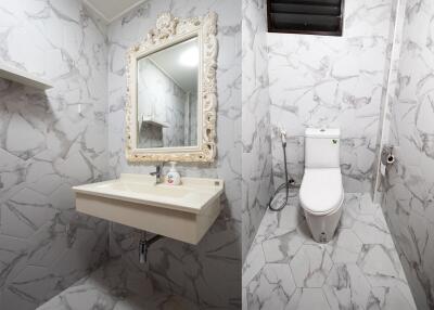 Modern bathroom with white marble tiles