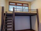 Bedroom with loft area and wooden flooring