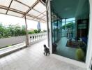 spacious balcony with view of city and greenery