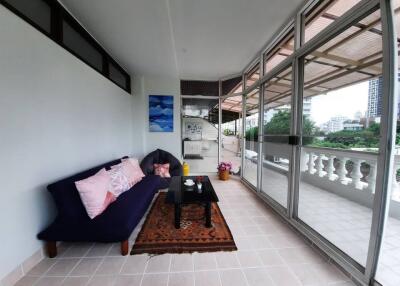 Spacious balcony with seating area