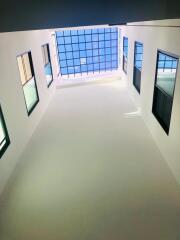 View of a high atrium with multiple windows and a large skylight