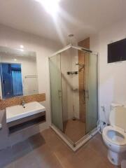 Modern bathroom with glass shower and large vanity