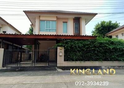 Two-story house with carport