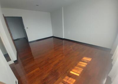 Empty living room with wooden floors