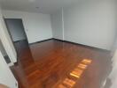 Empty living room with wooden floors