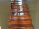 Polished wooden staircase with brown steps