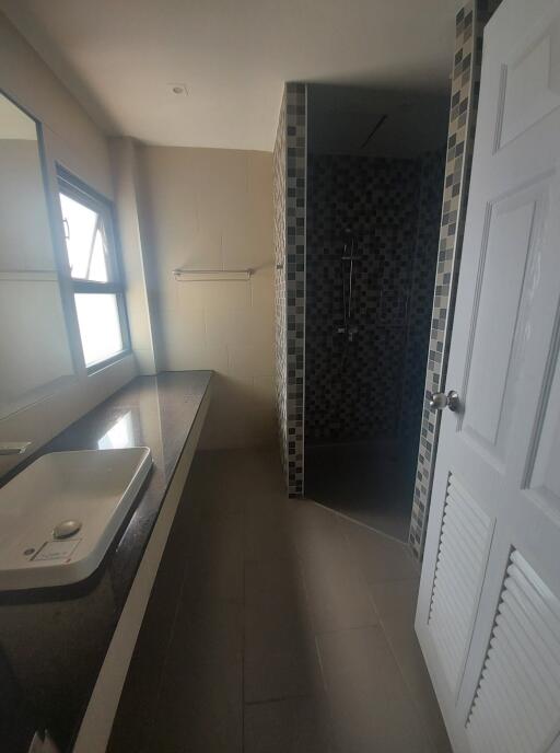 Modern bathroom with sink and shower area