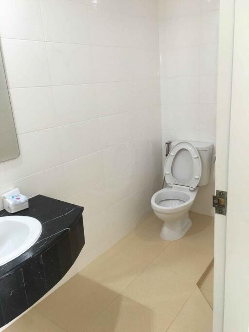 Modern bathroom with a white toilet and sink