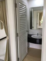 Bathroom with mirror and sink