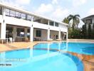 Outdoor swimming pool with surrounding seating area