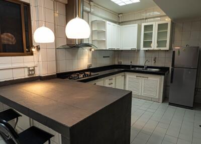 Modern kitchen with black countertop and island