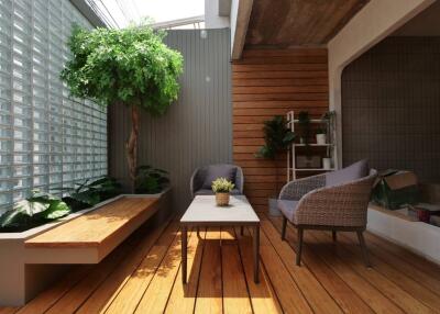 Modern terrace with seating area and indoor plants