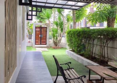 Outdoor garden with seating and greenery