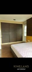 Modern bedroom with a large bed and built-in wardrobe