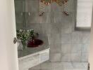 Bathroom with tiled walls and sink