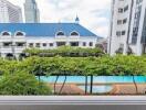 View of swimming pool and surrounding buildings