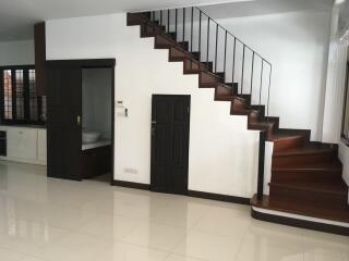 Staircase and entrance to a room