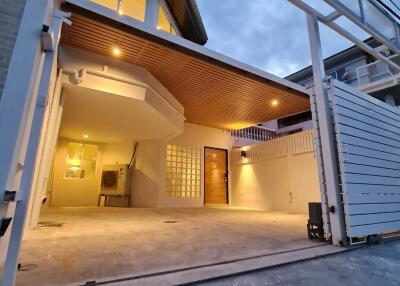 Modern two-story house with a carport