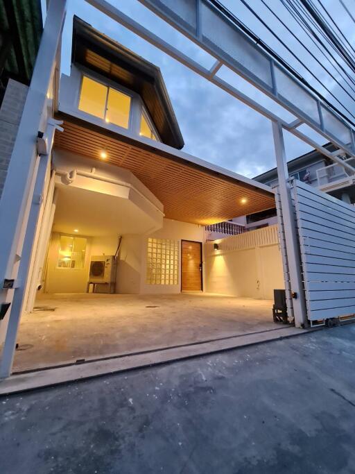 Modern two-story house with a carport