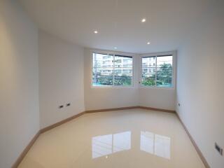 Spacious living room with large windows