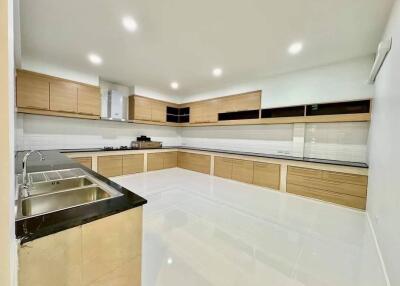 Modern kitchen with wooden cabinets and ample countertop space