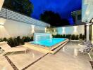 Modern backyard with illuminated swimming pool