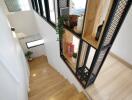 Modern staircase with wooden steps and decorative shelving