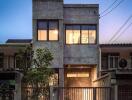 Exterior view of a modern two-story house at dusk