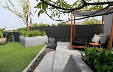 beautifully landscaped garden with seating area