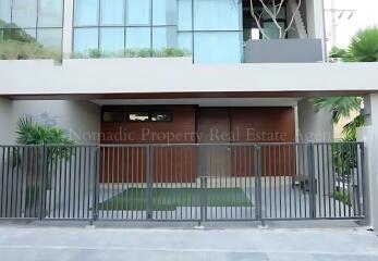 Modern building exterior with gated entry