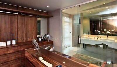 Modern bathroom with wooden accents and large mirror