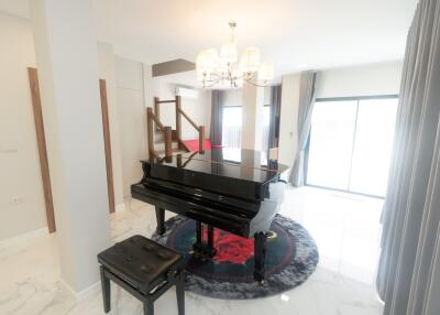 Living room with a piano and elegant decor