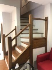 Wooden staircase with brown railing