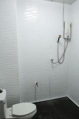 Modern bathroom with white tile walls and water heater