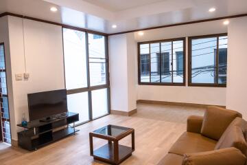 Modern living room with TV and seating