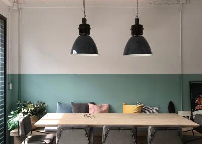 Modern dining area with pendant lighting and seating