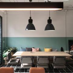 Modern dining area with pendant lighting and seating