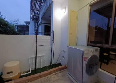 Outdoor laundry area with washing machine