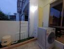 Outdoor laundry area with washing machine