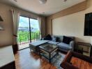 Modern living room with large window and balcony view