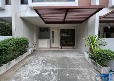 Front view of a modern house with a carport