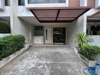 Front view of a modern house with a carport