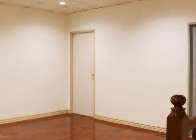 Empty room with wooden floor and white walls