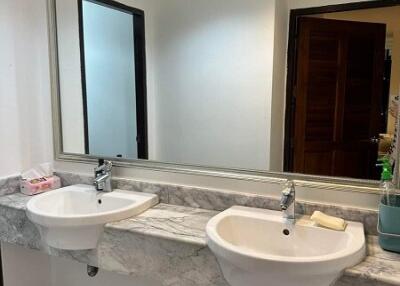 Double sink bathroom with marble countertop