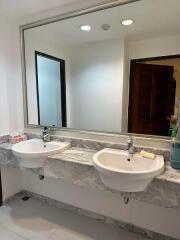 Double sink bathroom with marble countertop